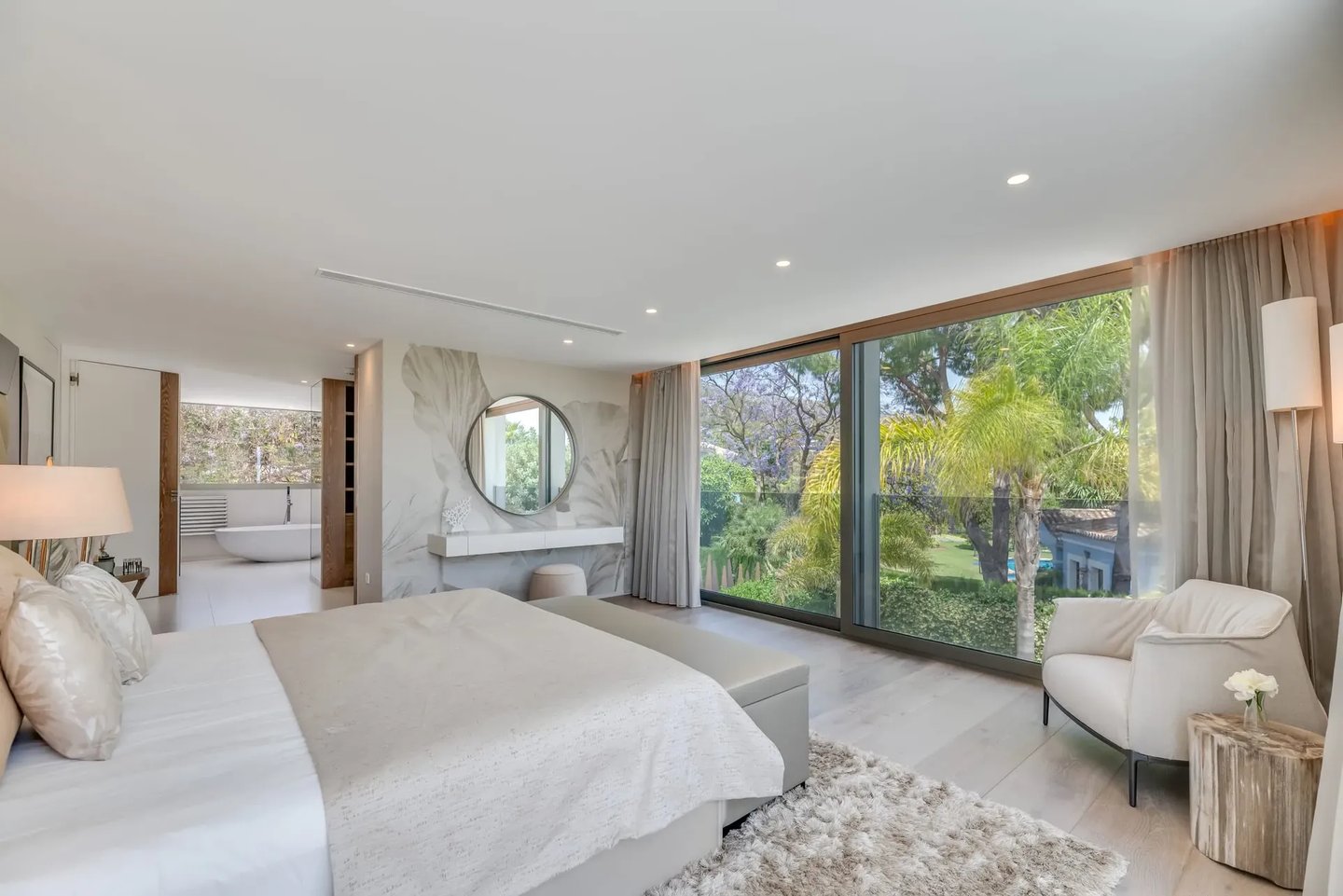 Bright bedroom at Villa Serenity with terrace and large windows