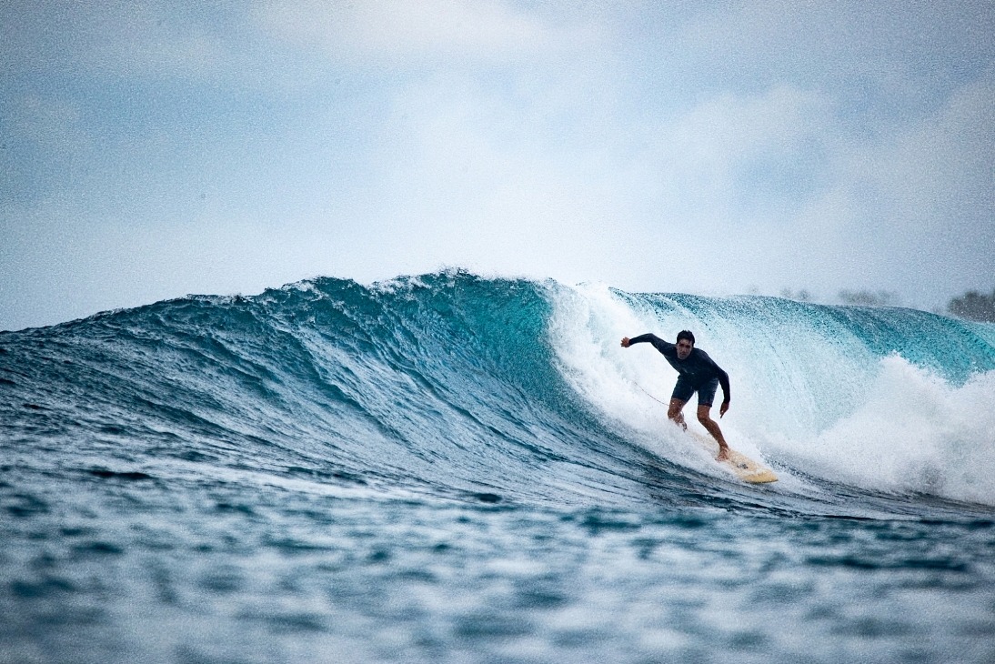 a man enjoying his wave in Mentawai 