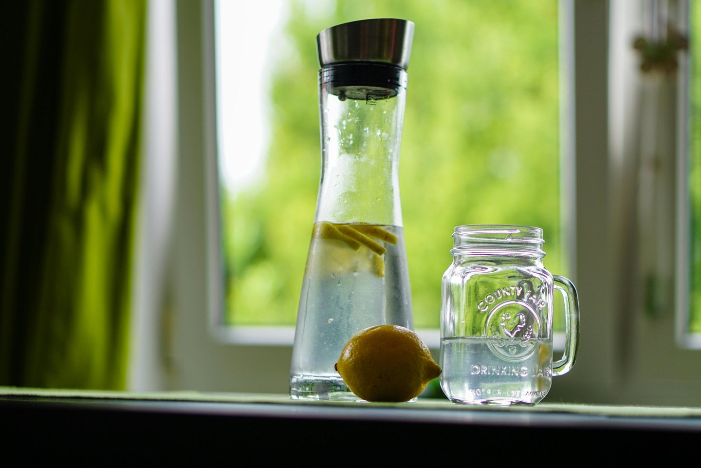 Refreshing detox water with lemon, cucumber, and mint in a glass jar, perfect boosting metabolism