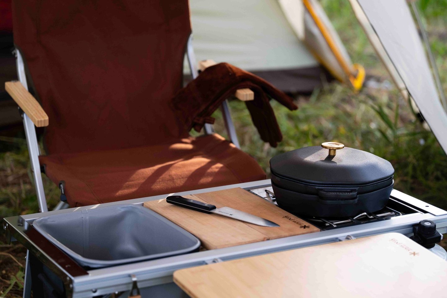 Snow Peak IGT Entry with a wash bin, cutting board, and flat burner.