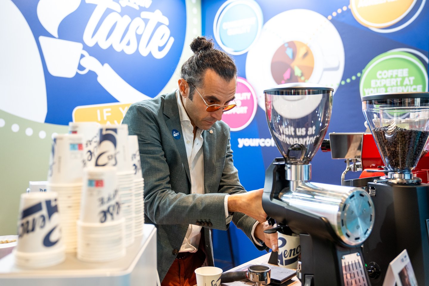Matteo grinding coffee during Host Milan 2023