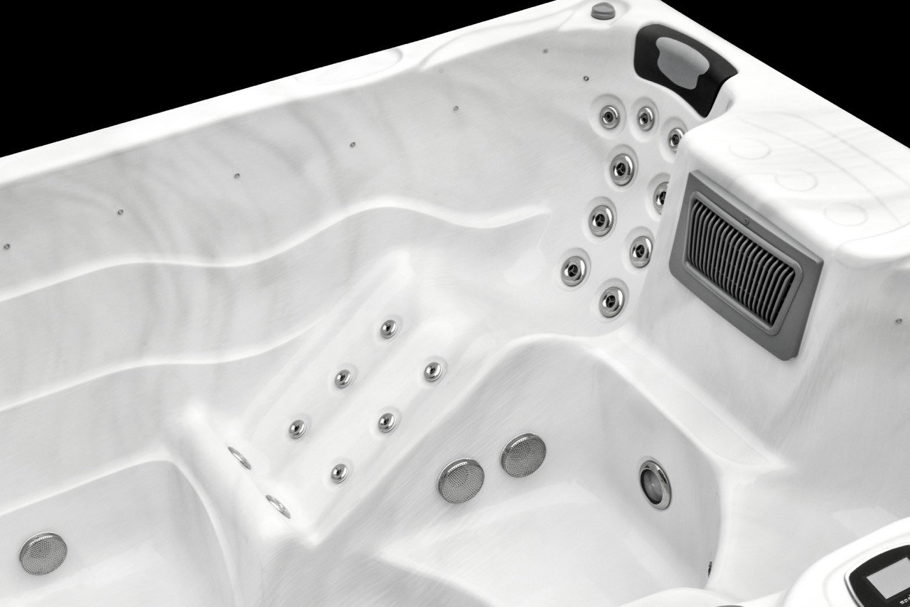 a hot tub with a remote control and a remote control