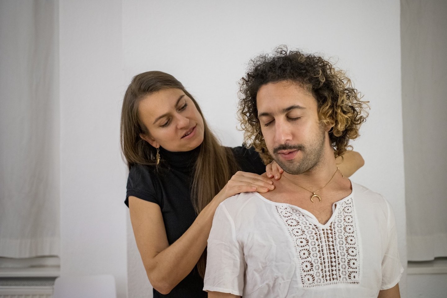 woman massaging mans shoulders
