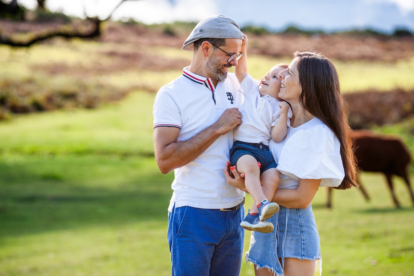 Family in Fanal Forest, dad and mom hugs child