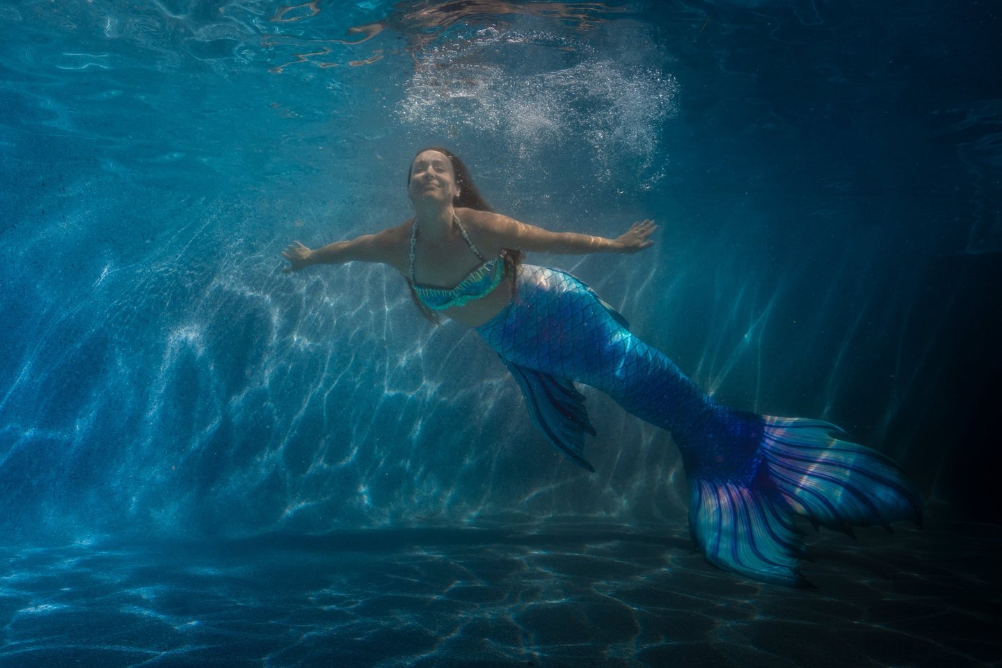 Professional Mermaid in a pool