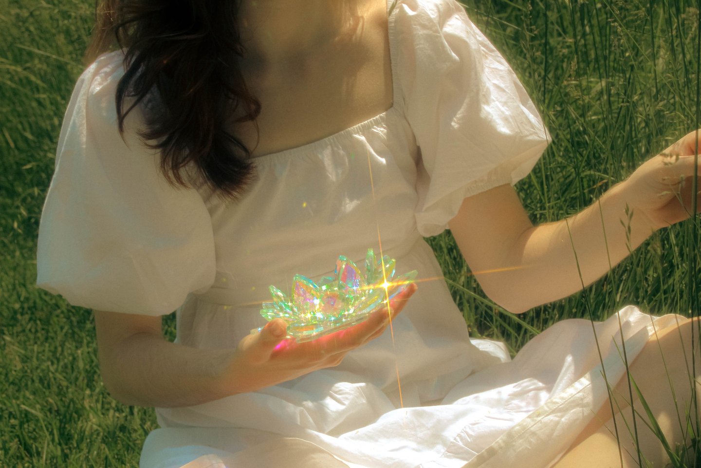 Creative cinematic detail image of model and prism in a park in northern virginia at golden hour