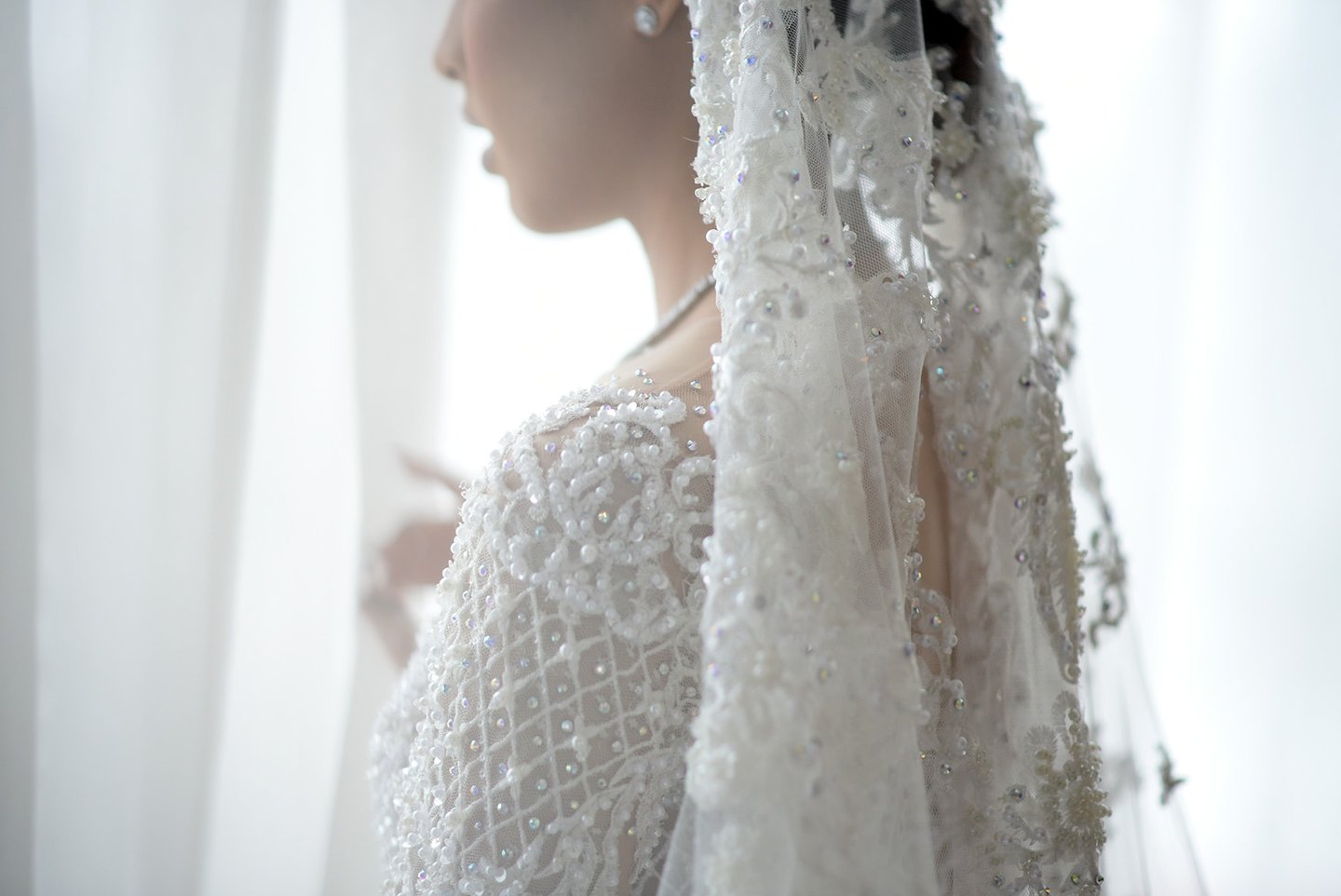 wedding photographer, a woman in a wedding dress with a veil
