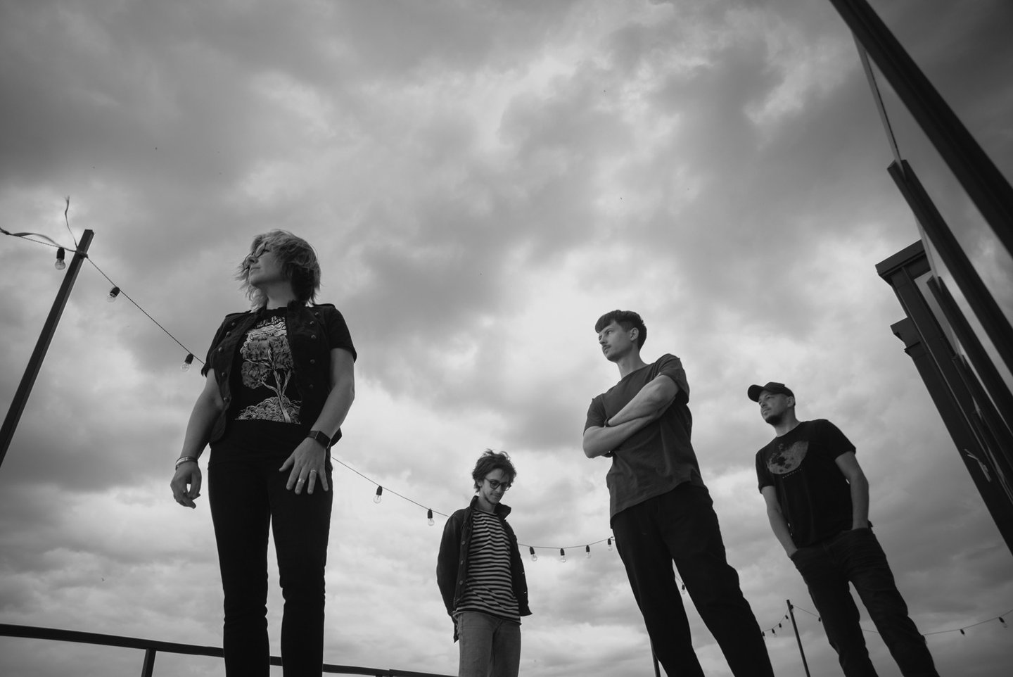 a group of people standing on a skateboard