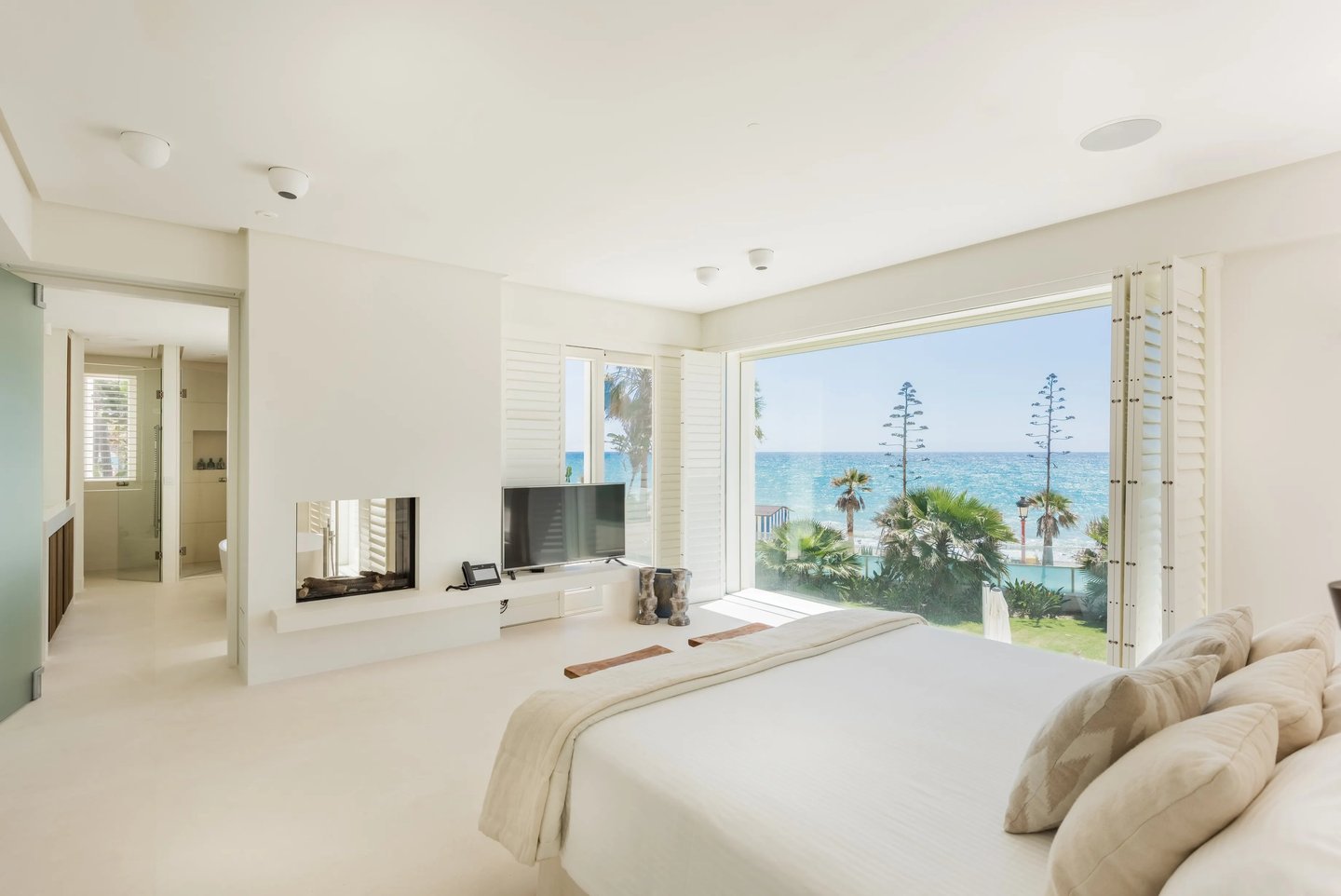 Bedroom suite with fireplace and Mediterranean views