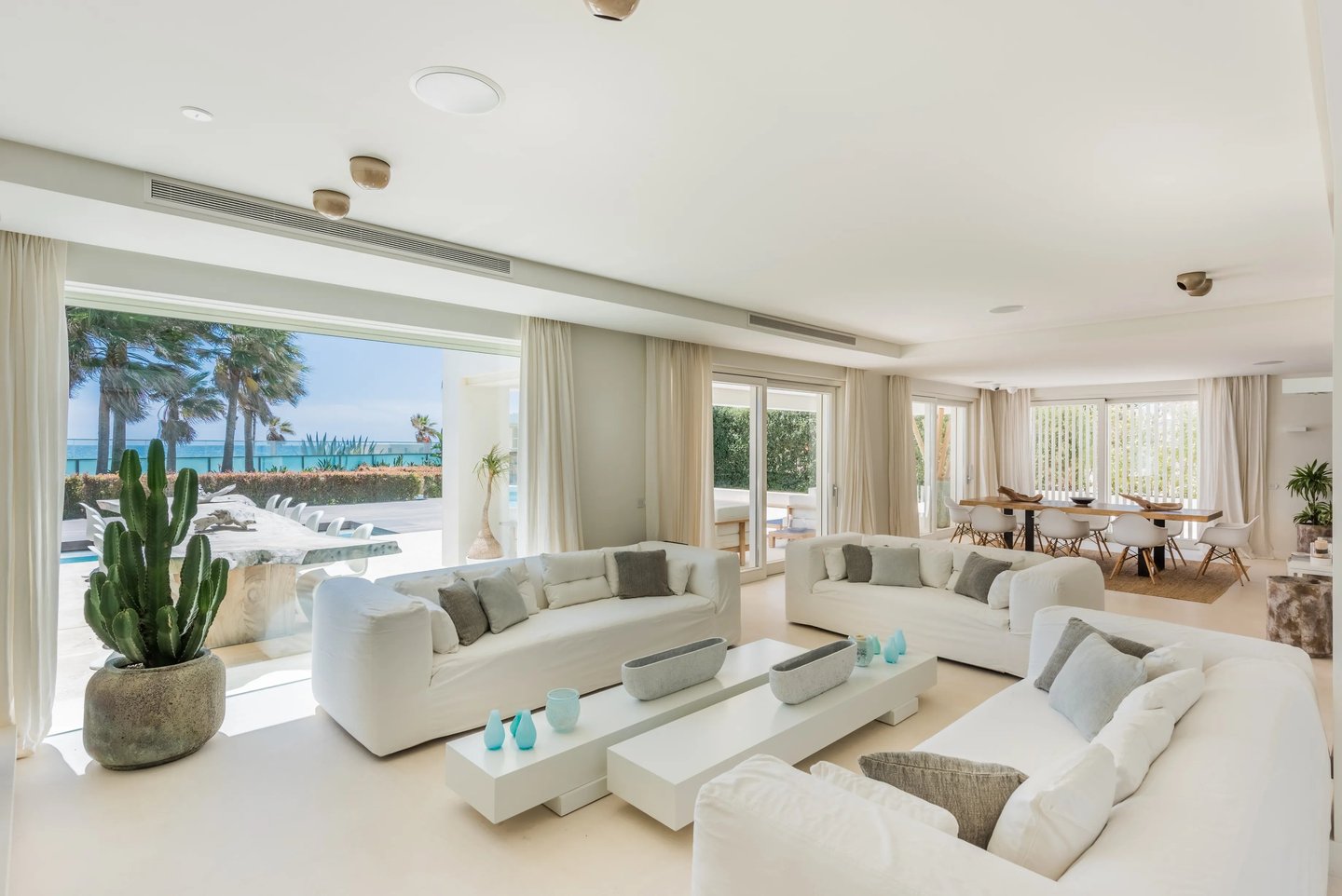 Bright living room with ocean views and terrace access