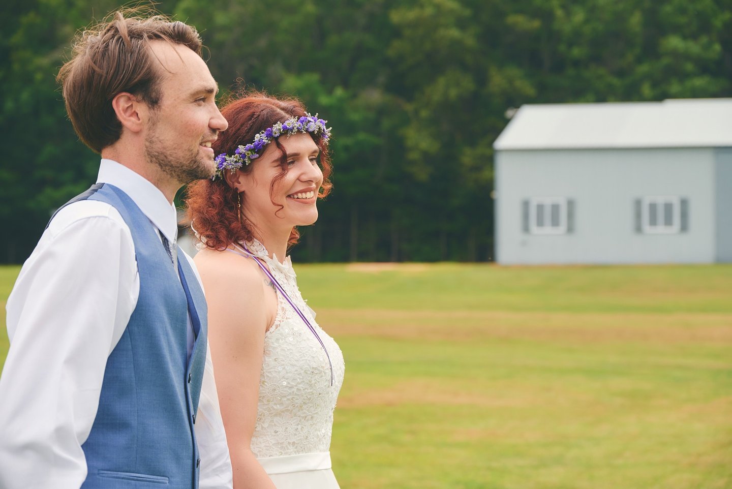 a man and woman walking in a farm land
