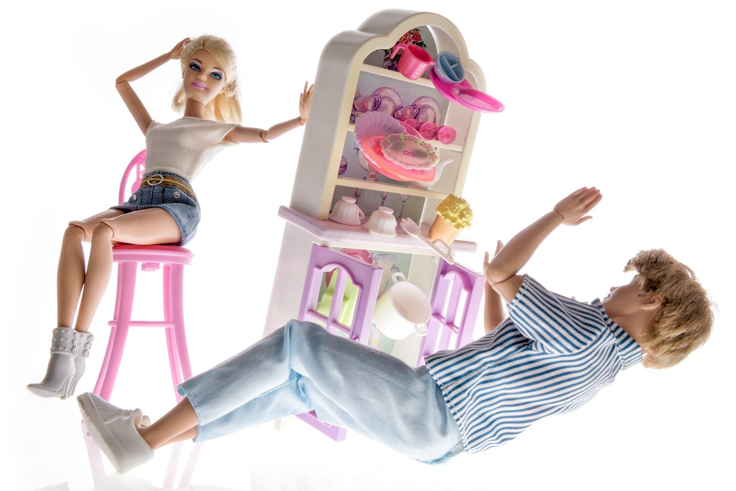 a doll sitting on a chair