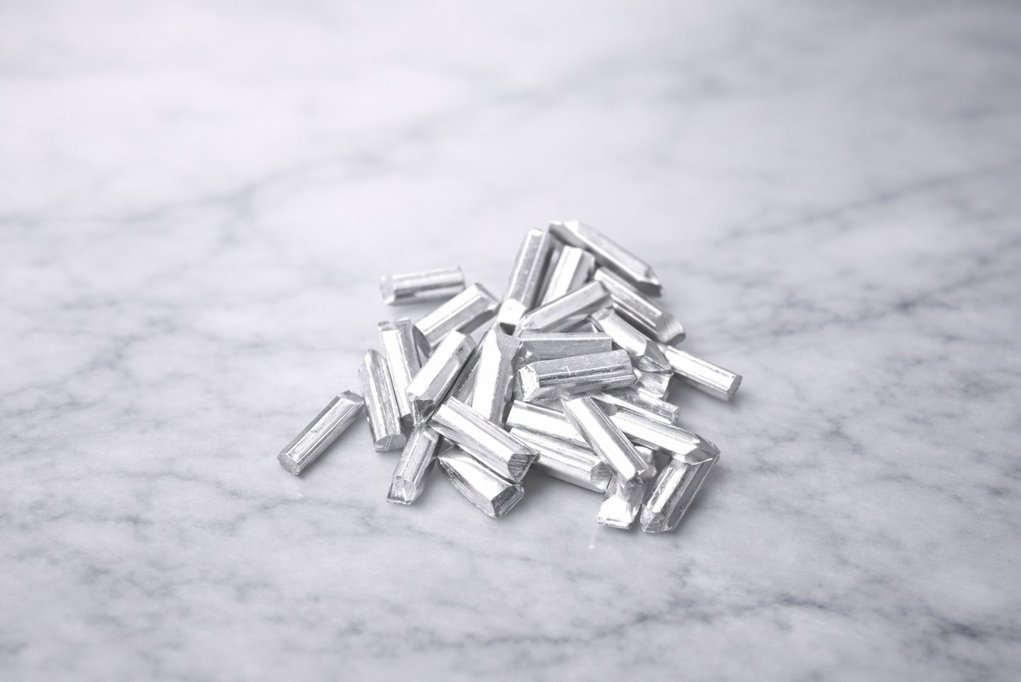 Pure silver grain pieces on light marble, showing texture for DIY jewelry making 5 gram