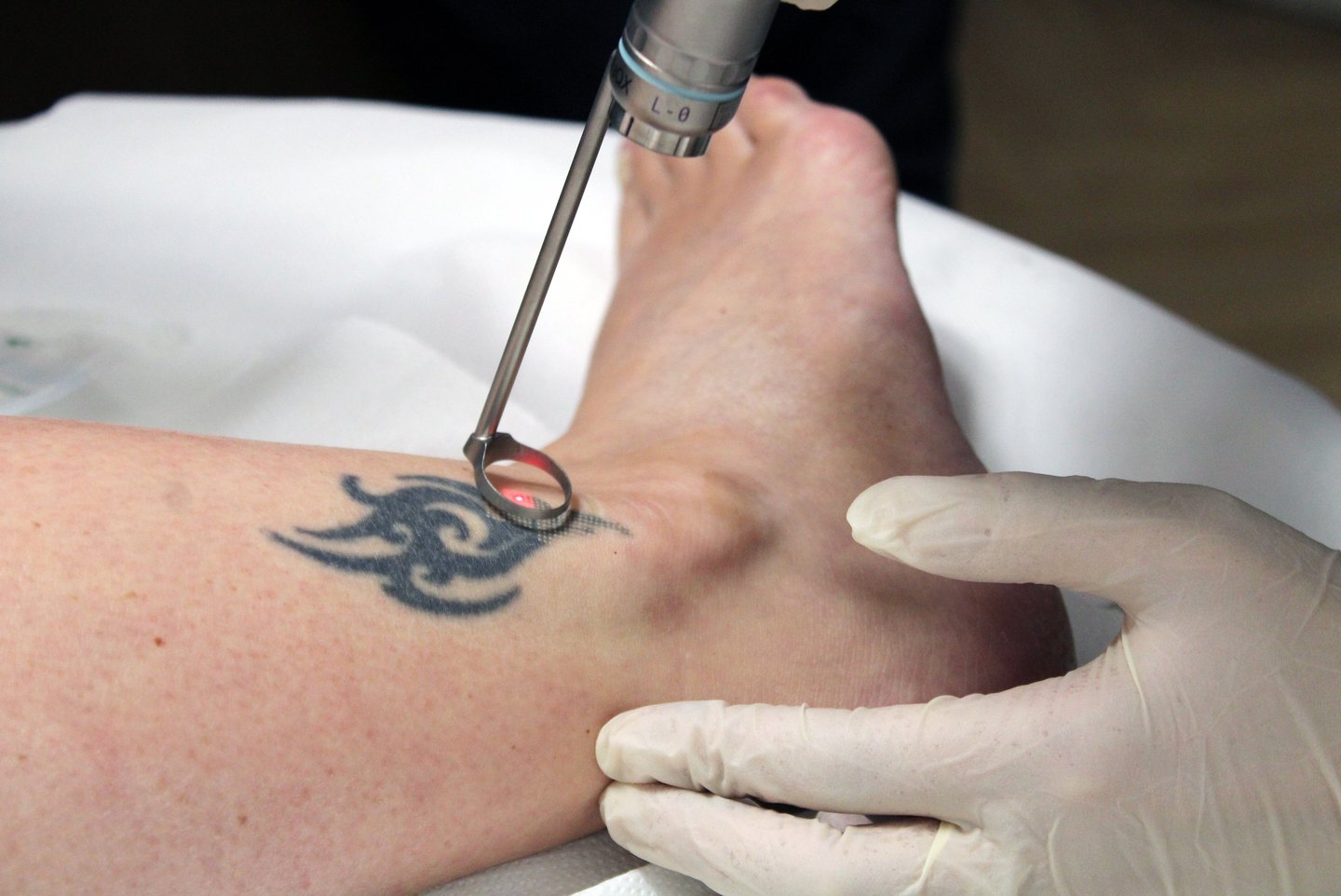 a person with a tattoo on their arm