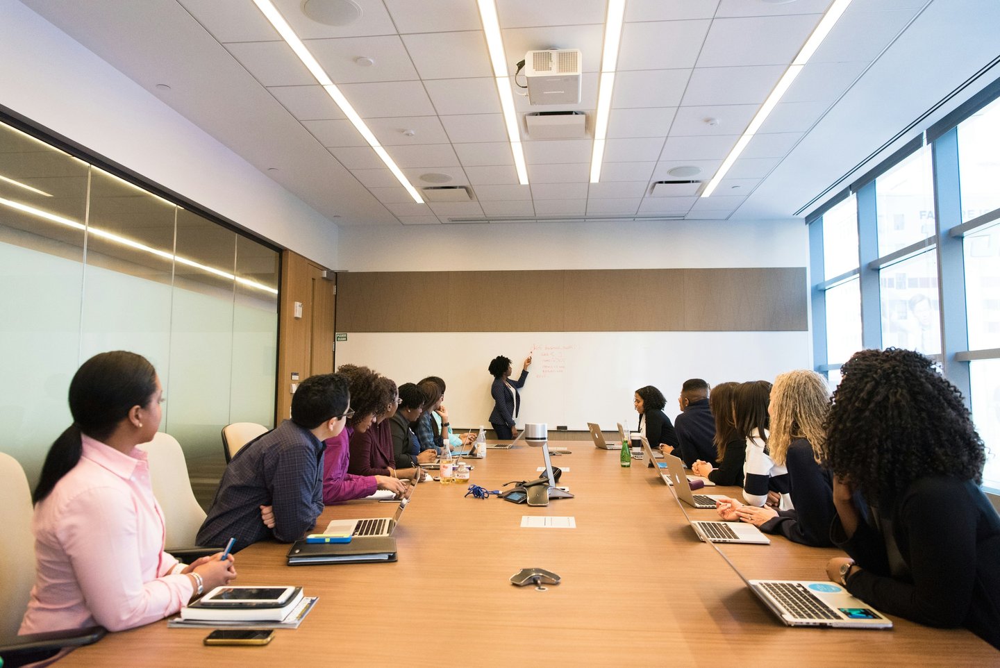 Attendees listen to a speaker during a leadership development presentation.