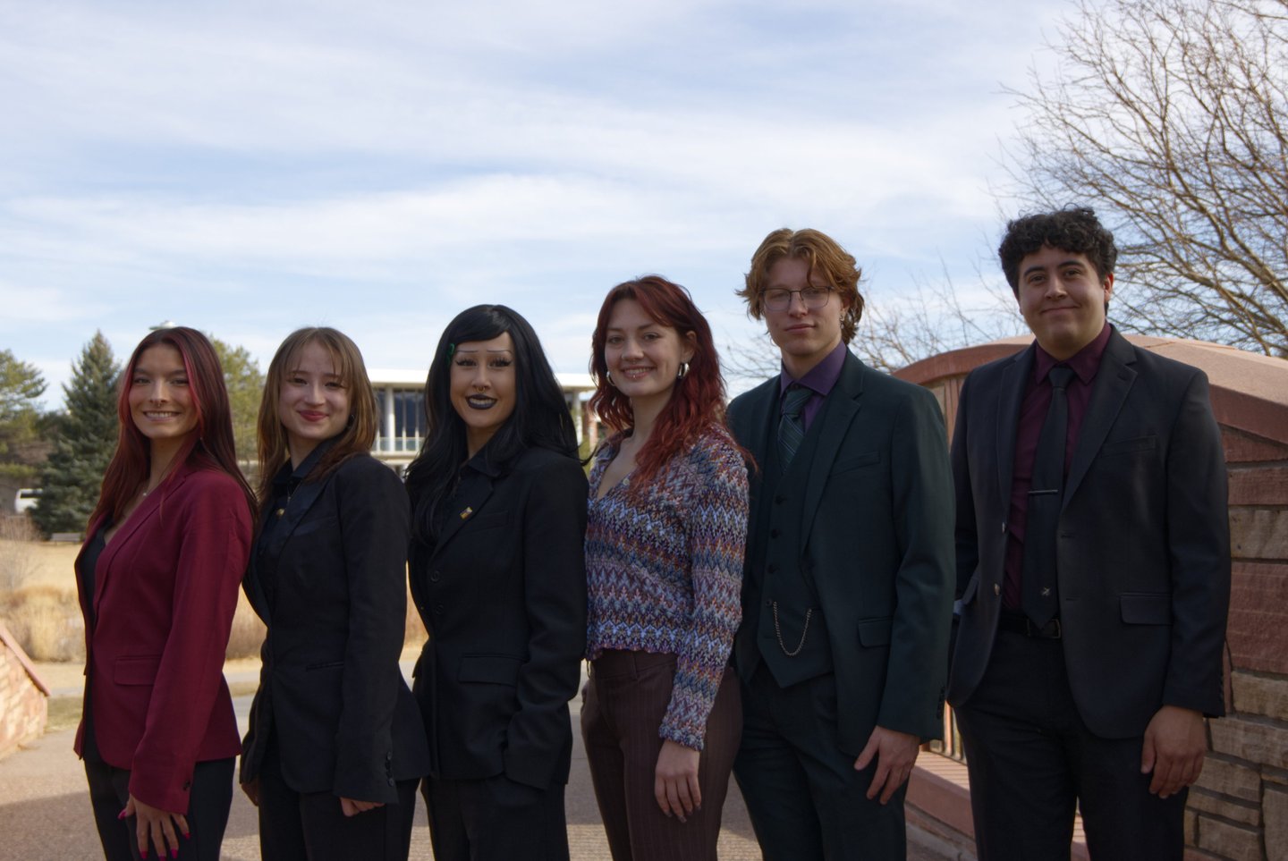 Image of Quesada-Stoner Gregg team standing next to each other.