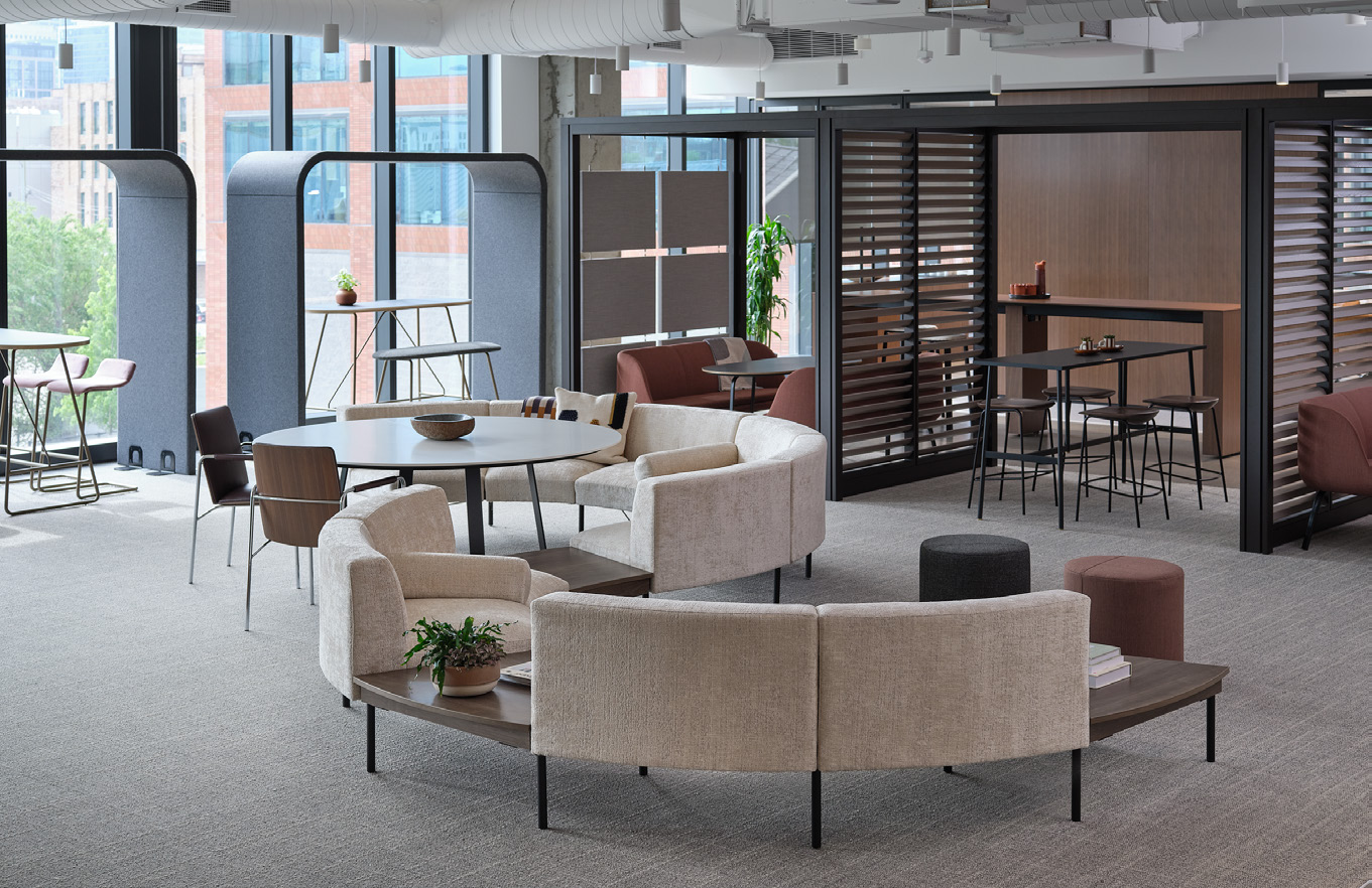 a room with a couch and chairs and a table