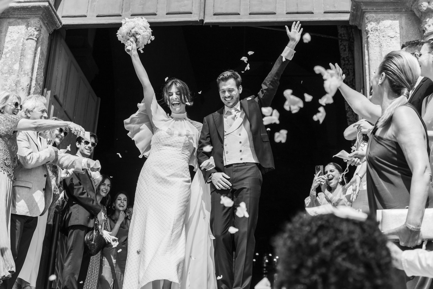 a bride and groom walking down the aisle of a wedding ceremony
