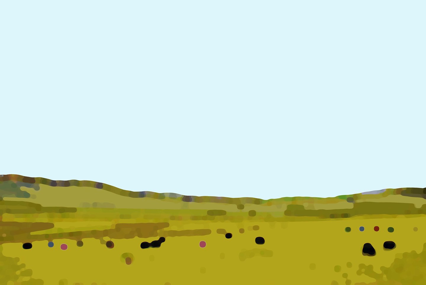 a field with a few cows grazing in the grass