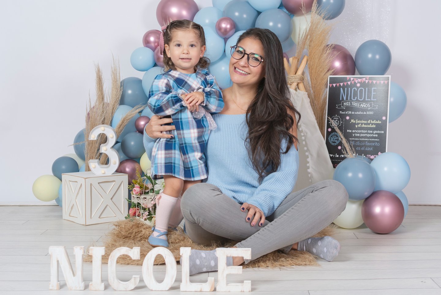 a woman and her son posing for a photo