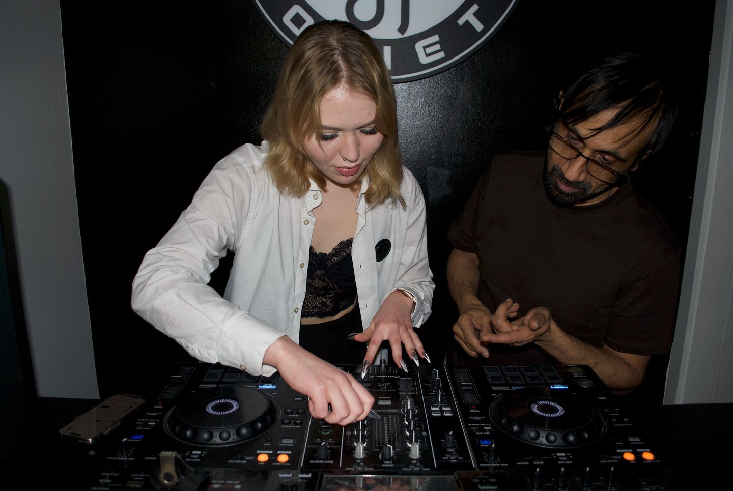 Student practicing beatmatching during one-on-one DJ lesson at Prague DJ Society