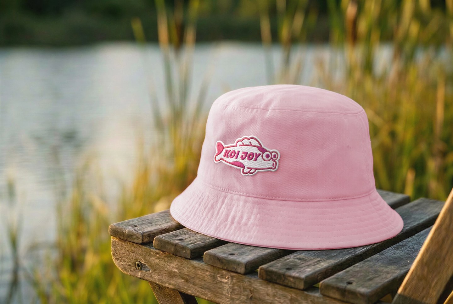 Pink bucket hat with KOIJOY patch representing local creation and independent design