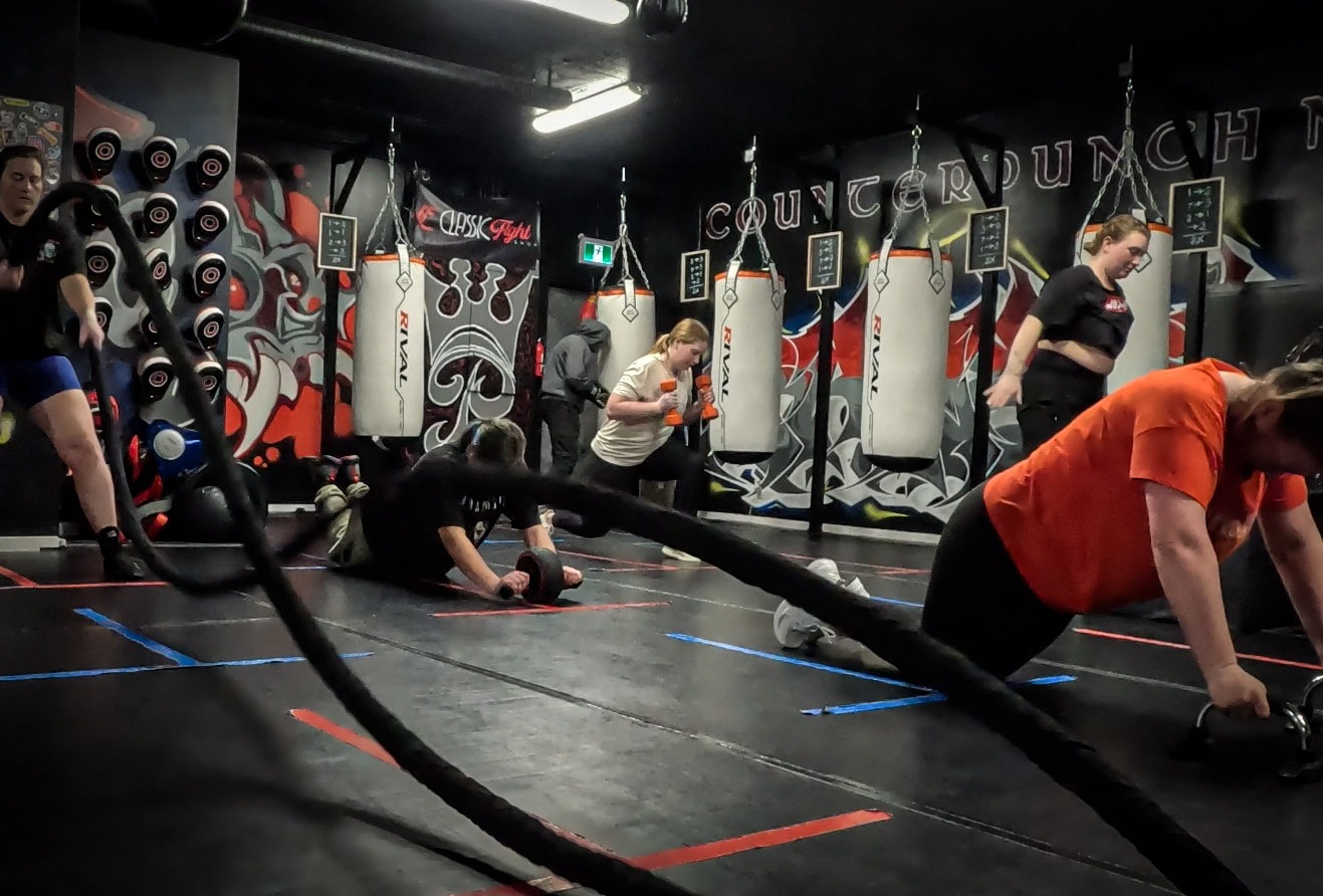 women doing boxing training cardio exercises in the Heels Off, Gloves On class