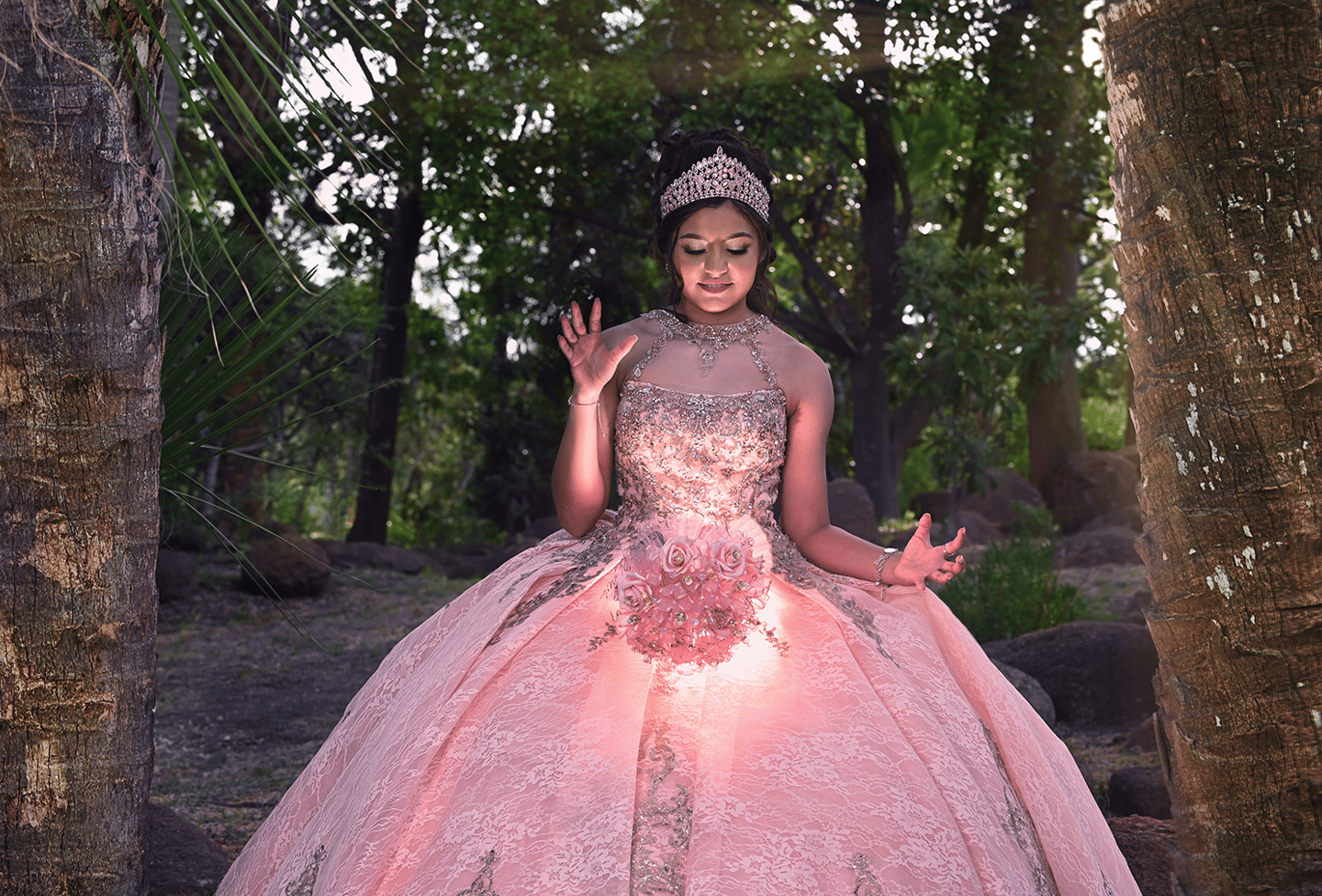 a woman in a pink dress posing for photographer