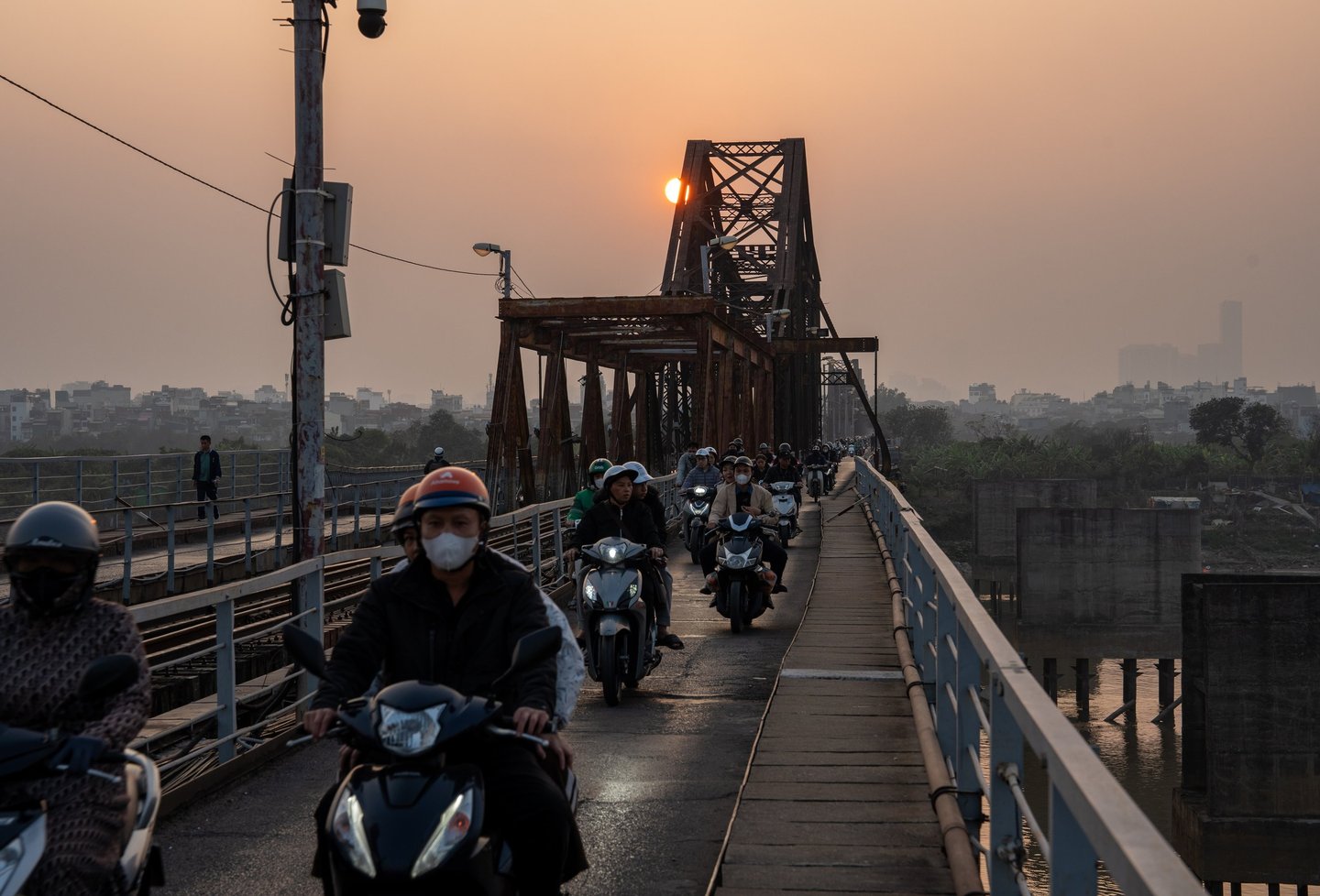 Vietnamese Motorbike Driver at the Long Bien Bridge in Hanoi City Vietnam Southeast Asia