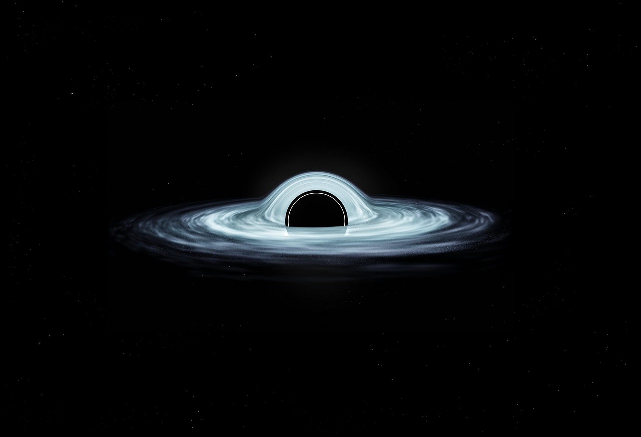Black Holes and Wormholes: Are They Gateways to Other Universes?