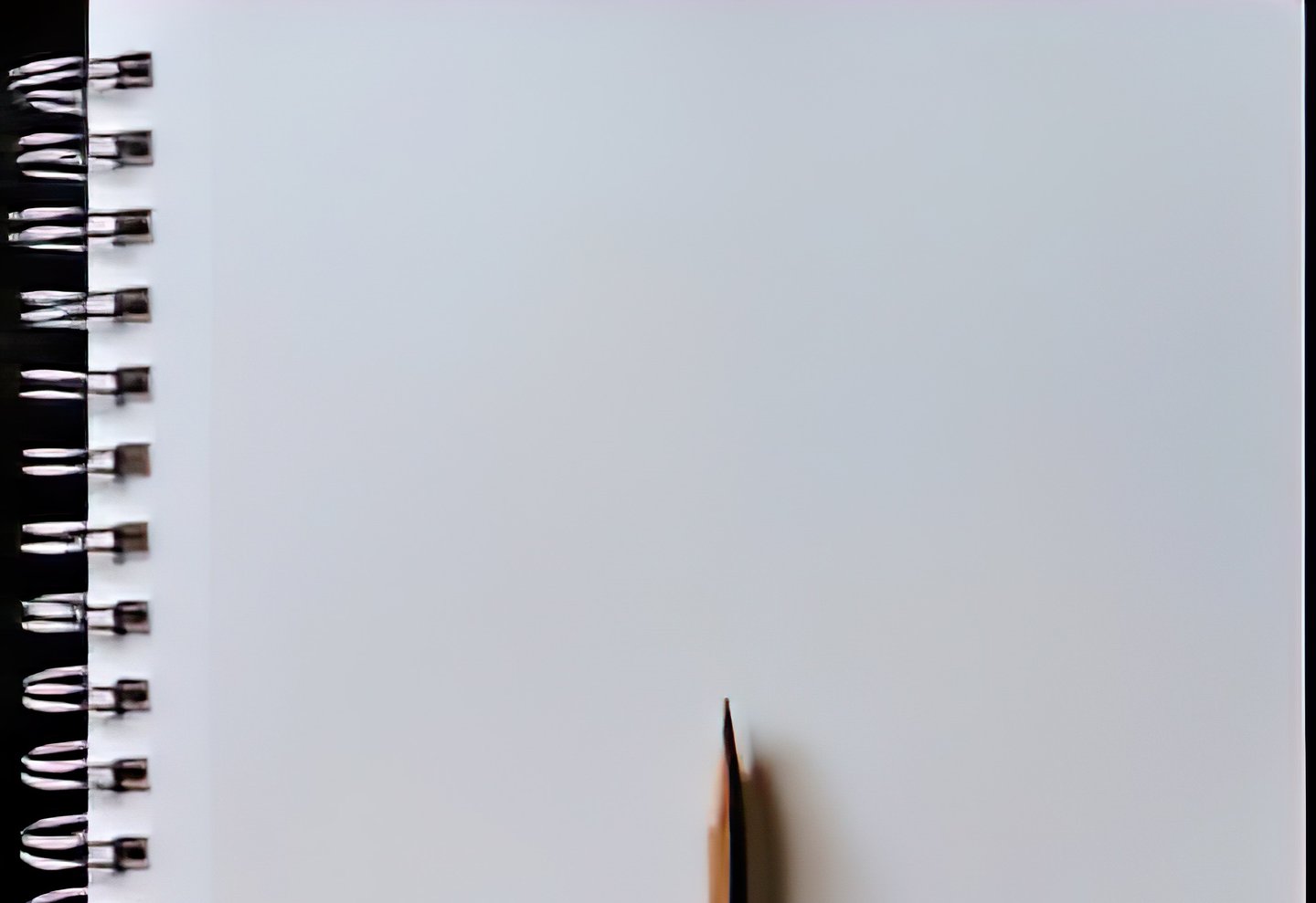 A blank spiral notebook with white pages