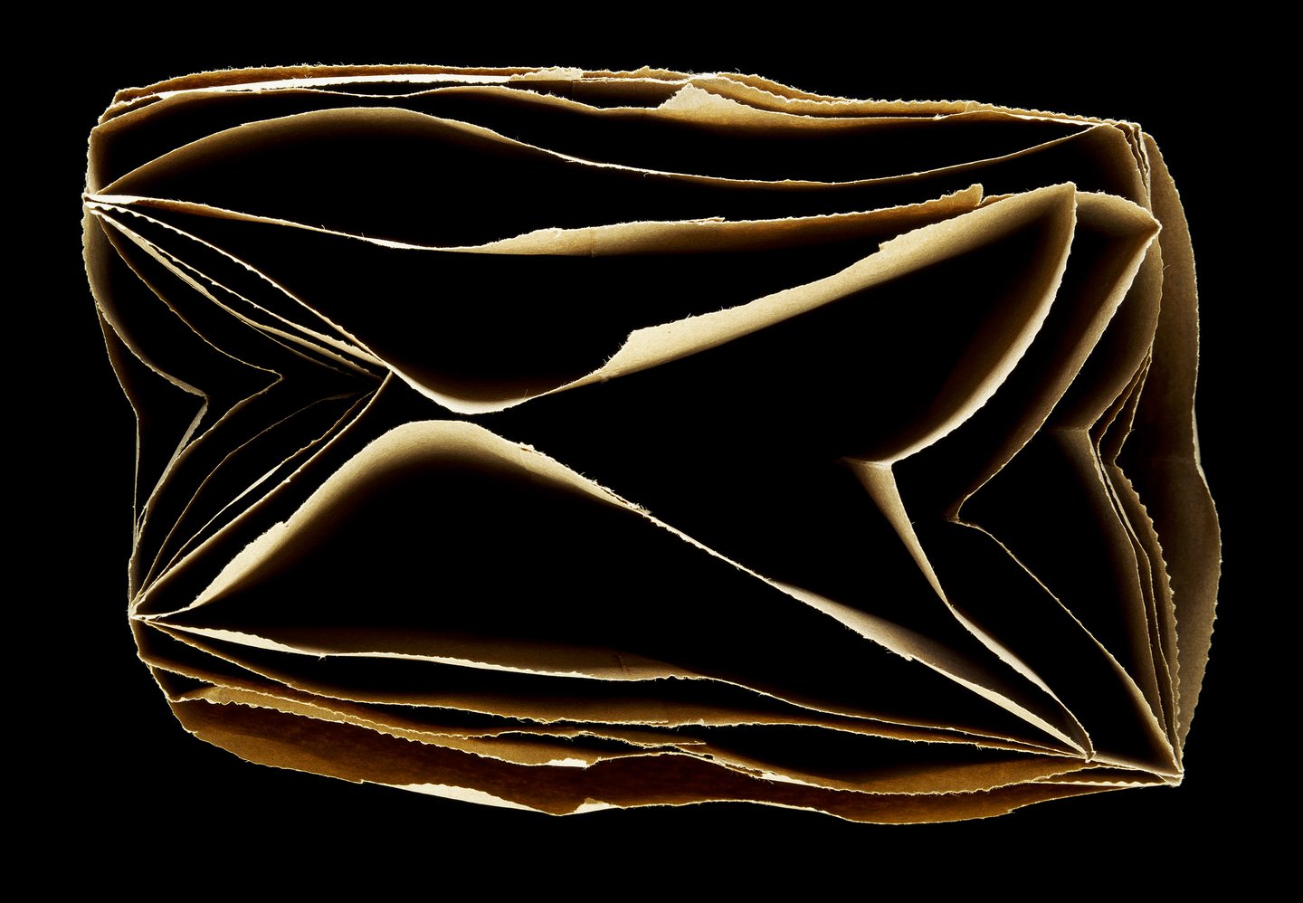 brown paper bags stacked inside each other from above on black