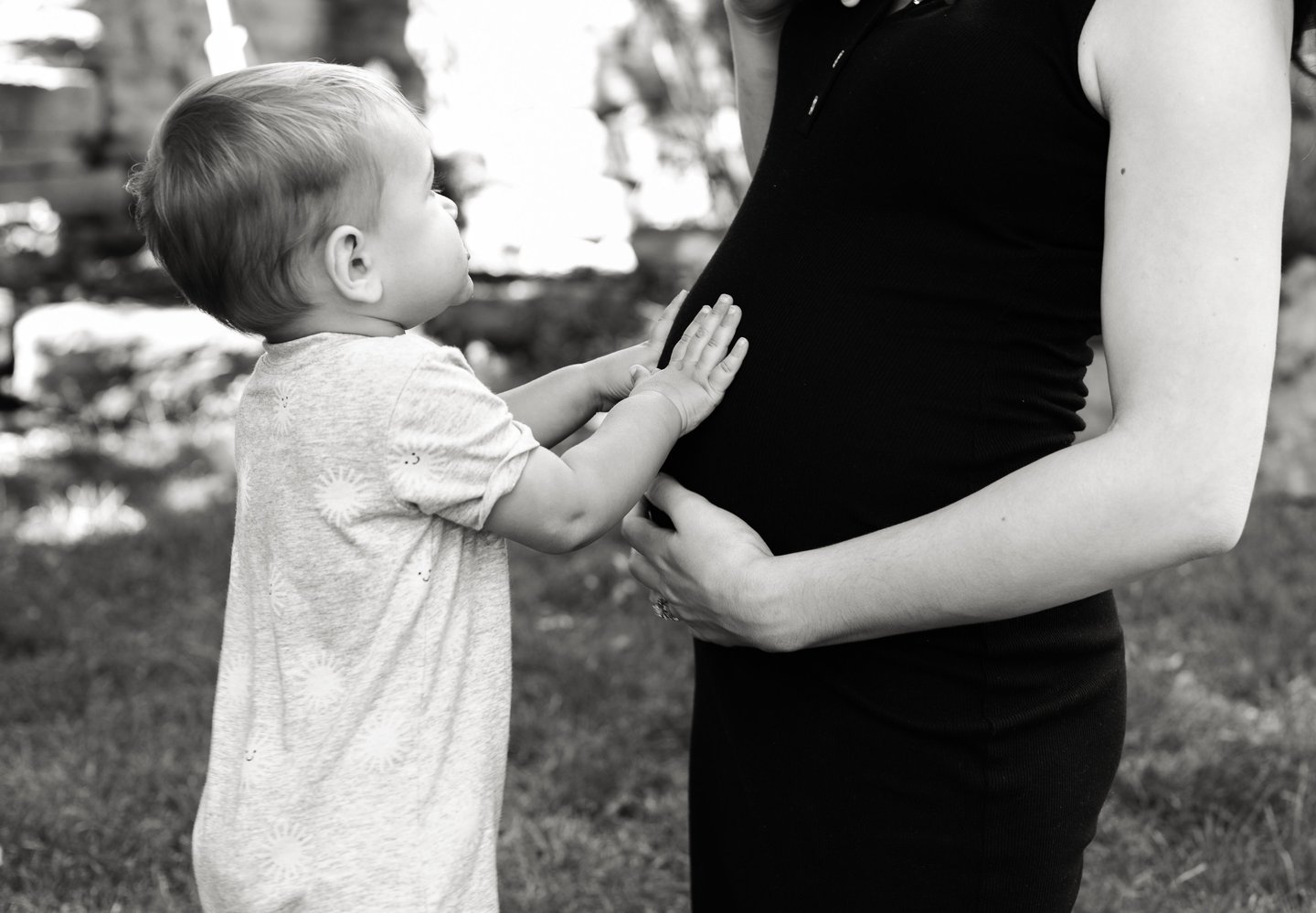 a pregnant woman holding her baby bump bump bump bump bump bump bump bump bump bump