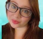 a woman with glasses and a blue background