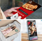 a woman holding a pizza box with a pizza box