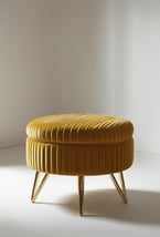 Butter yellow velvet ottoman with ribbed texture and gold legs, minimal and elegant.