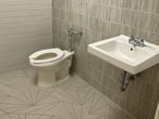 fully renovated bathroom with different tiles