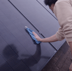 Solar panel installation being hand cleaned
