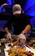 a chef preparing food in a restaurant