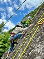 Kids experiencing rock climbing in Sasso Remenno area.
