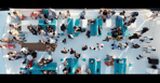 An aerial view of a boat carrying pre-wedding party guests in Cabo, captured by Los Cabos Wedding Films. Professional videogr