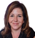 a woman with a black shirt and earrings