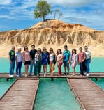 a group of people standing on Blue lake