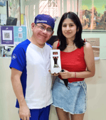 a man and woman standing next to each other