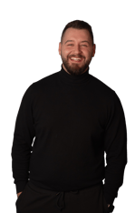 a man with a beard and a beard, smiling