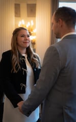 a man and woman holding hands and shaking hands