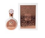 a bottle of perfume with a gold foiled bottle
