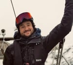A mountain guide on a boat smiling | ski and sail in Norway