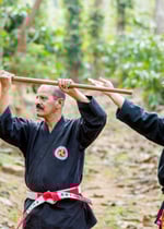 Hanshi tetsuo Taka Miyagi teaching Hanshi Ravindran K.P a kobudo technique.
