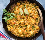 A fragrant, ghee-kissed basmati rice dish with golden-fried paneer, vibrant veggies, and whole spice